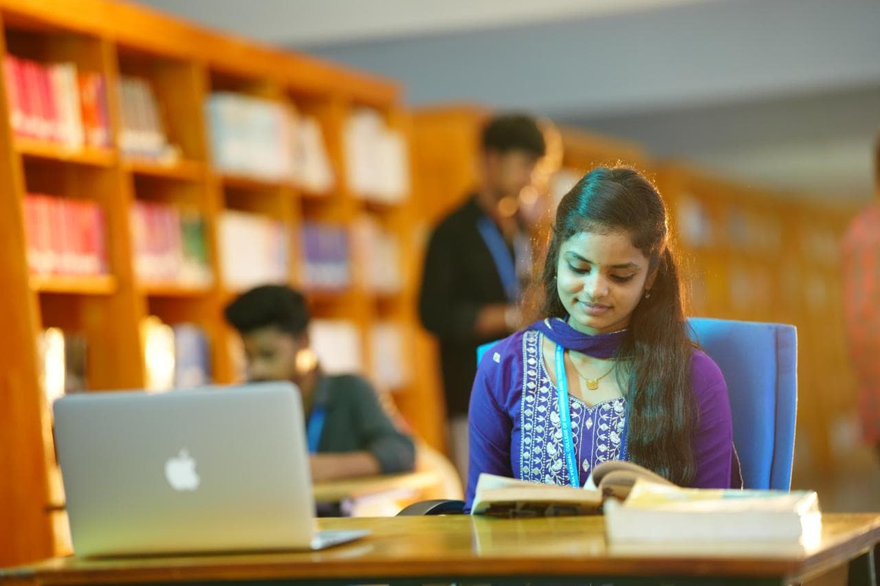 A student reading in the SVPP central library